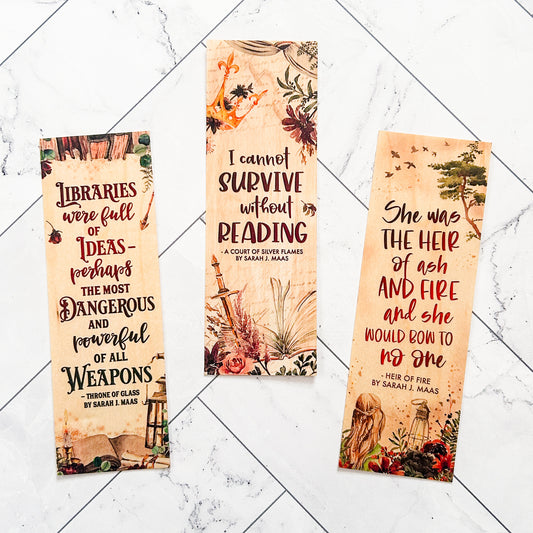 Watercolor quotes from Sarah J. Maas series ACOTAR and Throne of Glass printed on wooden bookmarks.