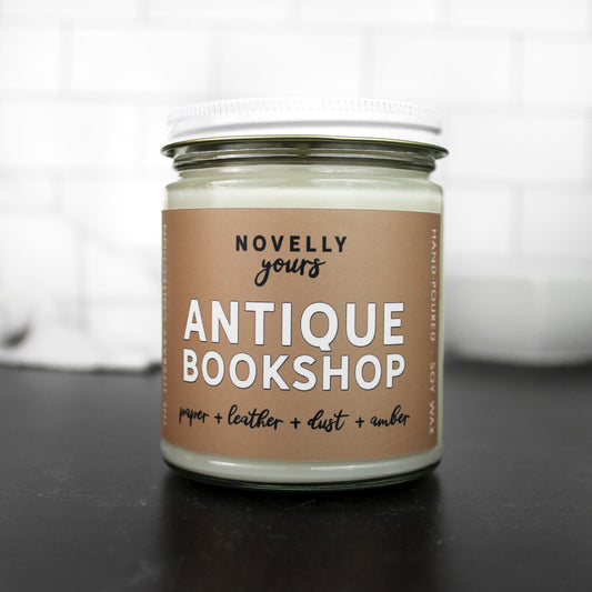 antique bookshop scented soy wax candle with tan label, inspired by vintage books and old bookshops