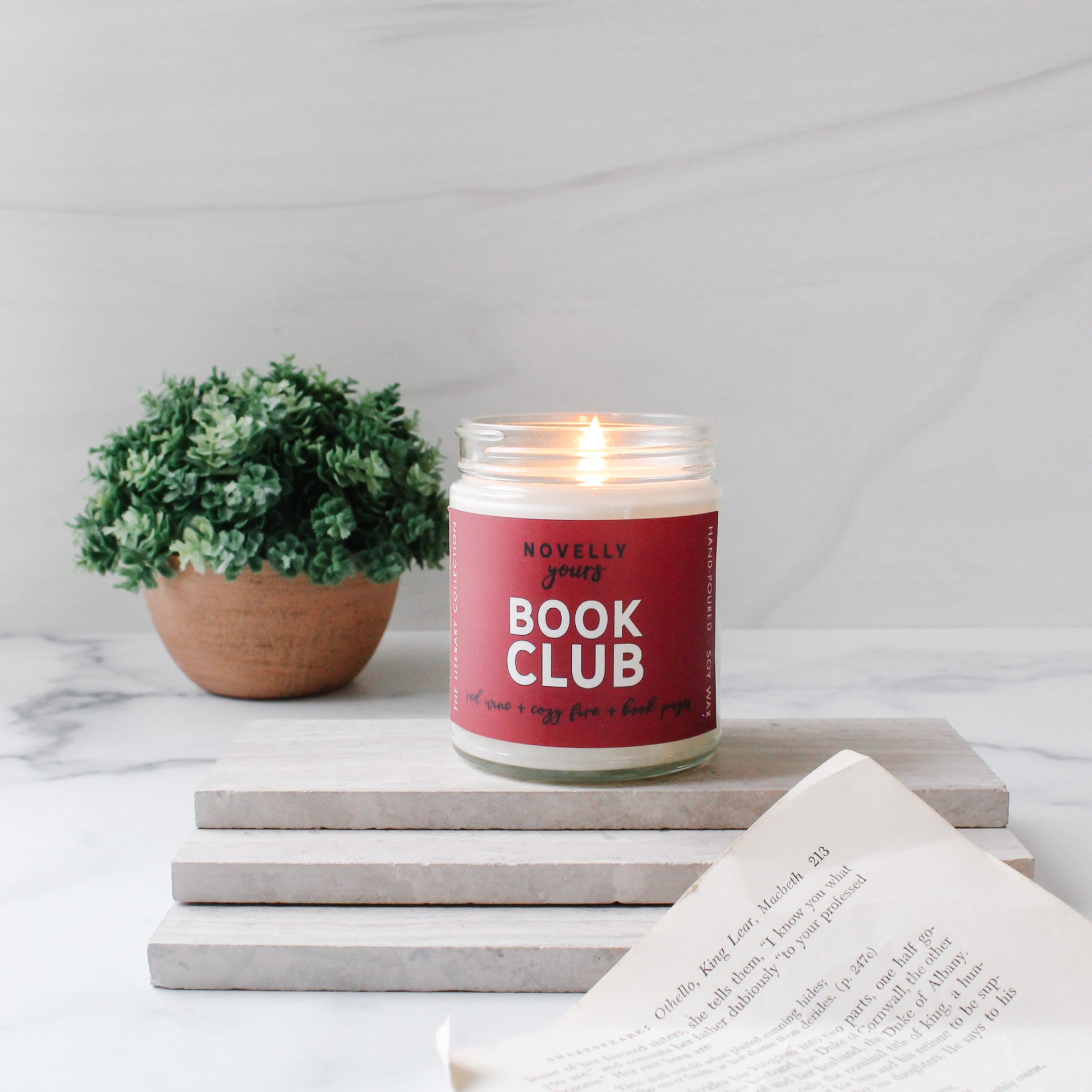 book club scented soy wax candle with fruit & fire scents with red label