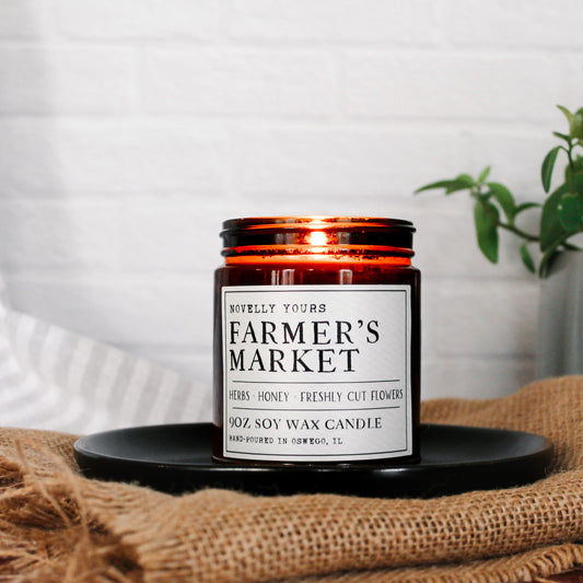 soy wax candle in amber jar called "Farmer's market" with rustic label aesthetic
