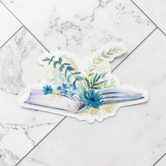 floral books sticker featuring blue and teal flowers with various greens on top of an open book
