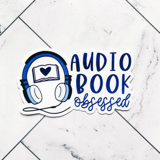 audiobook sticker with headphones and book with heart