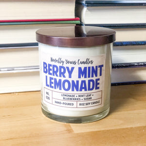 soy wax candle scented like lemonade and blueberry in clear jar with bronze lid