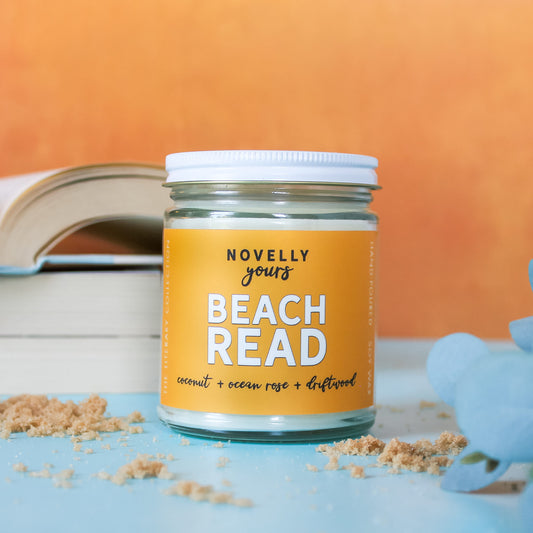 beach read candle with summery orange label, book themed scented soy wax candle