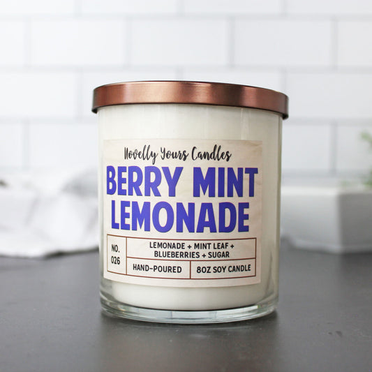 soy wax candle scented like lemonade and blueberry in clear jar with bronze lid