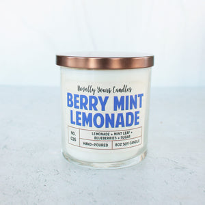 soy wax candle scented like lemonade and blueberry in clear jar with bronze lid