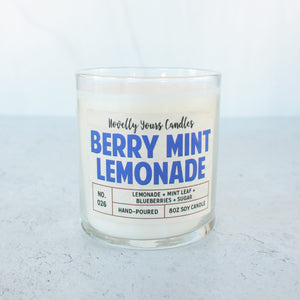 soy wax candle scented like lemonade and blueberry in clear jar with bronze lid