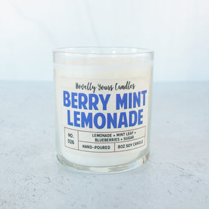 soy wax candle scented like lemonade and blueberry in clear jar with bronze lid