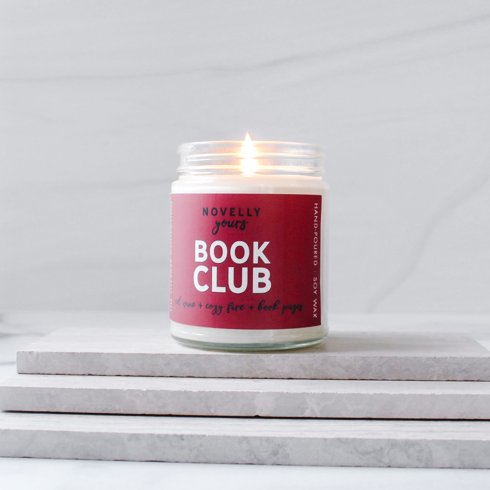book club scented soy wax candle with fruit & fire scents with red label