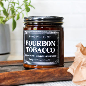 bourbon tobacco named candle in amber glass jar with black lid