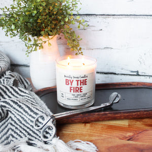 By the Fire · woodsy bonfire outdoor scented soy wax candle
