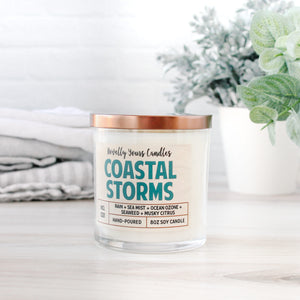coastal storms ocean scented candle in clear glass tumbler jar with bronze lid and two cotton wicks made by novelly yours