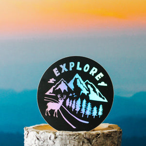 black and rainbow holographic sticker with outdoors and forest scenery with text 