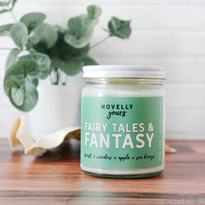 fairy tales & fantasy bookish candle with a green label and clear glass jar
