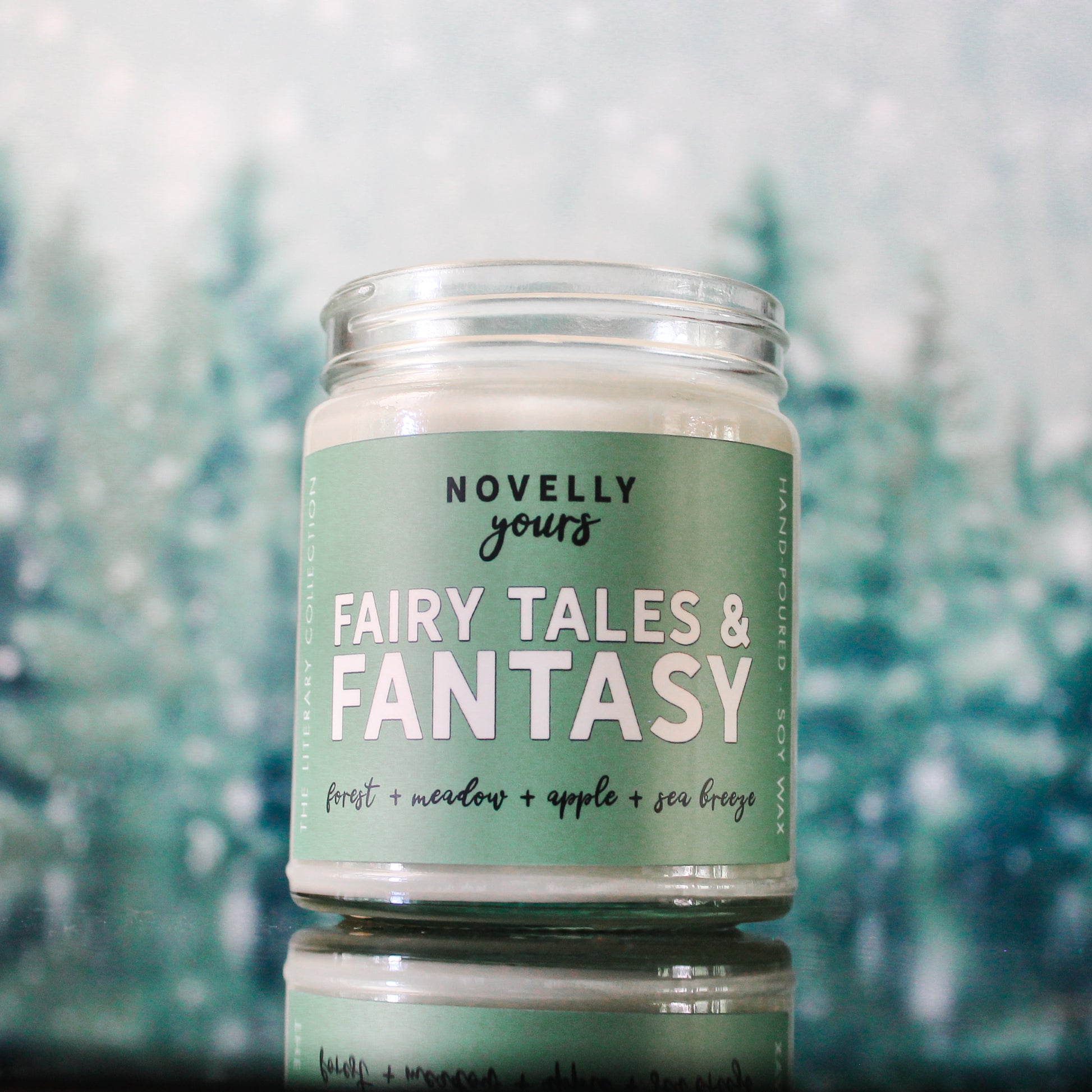 fairy tales & fantasy bookish candle with a green label and clear glass jar
