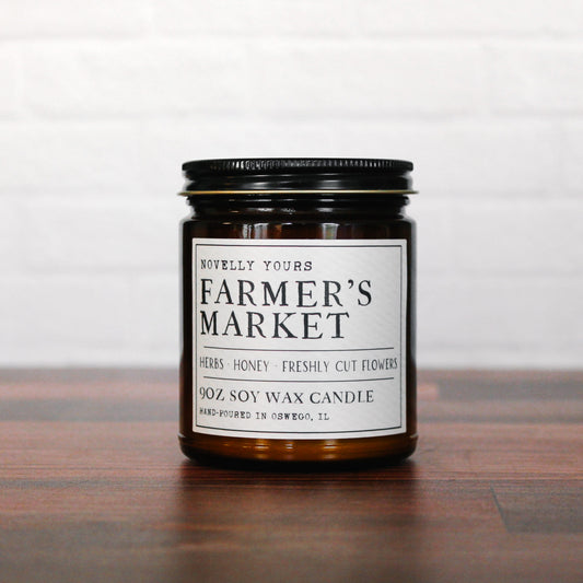 soy wax candle in amber jar called "Farmer's market" with rustic label aesthetic