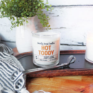 hot toddy scented soy wax candle in clear glass tumbler with two cotton wicks and bronze lid