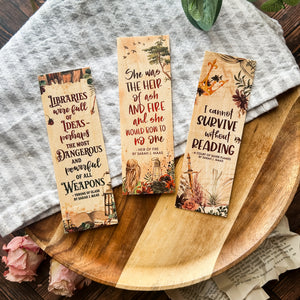 Three woodmarks with quotes from Throne of Glass, A Court of Silver Flames, and Heir of Fire