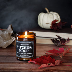witching hour cider and apple scented soy wax candle in amber jar with black lid. fall scented candle