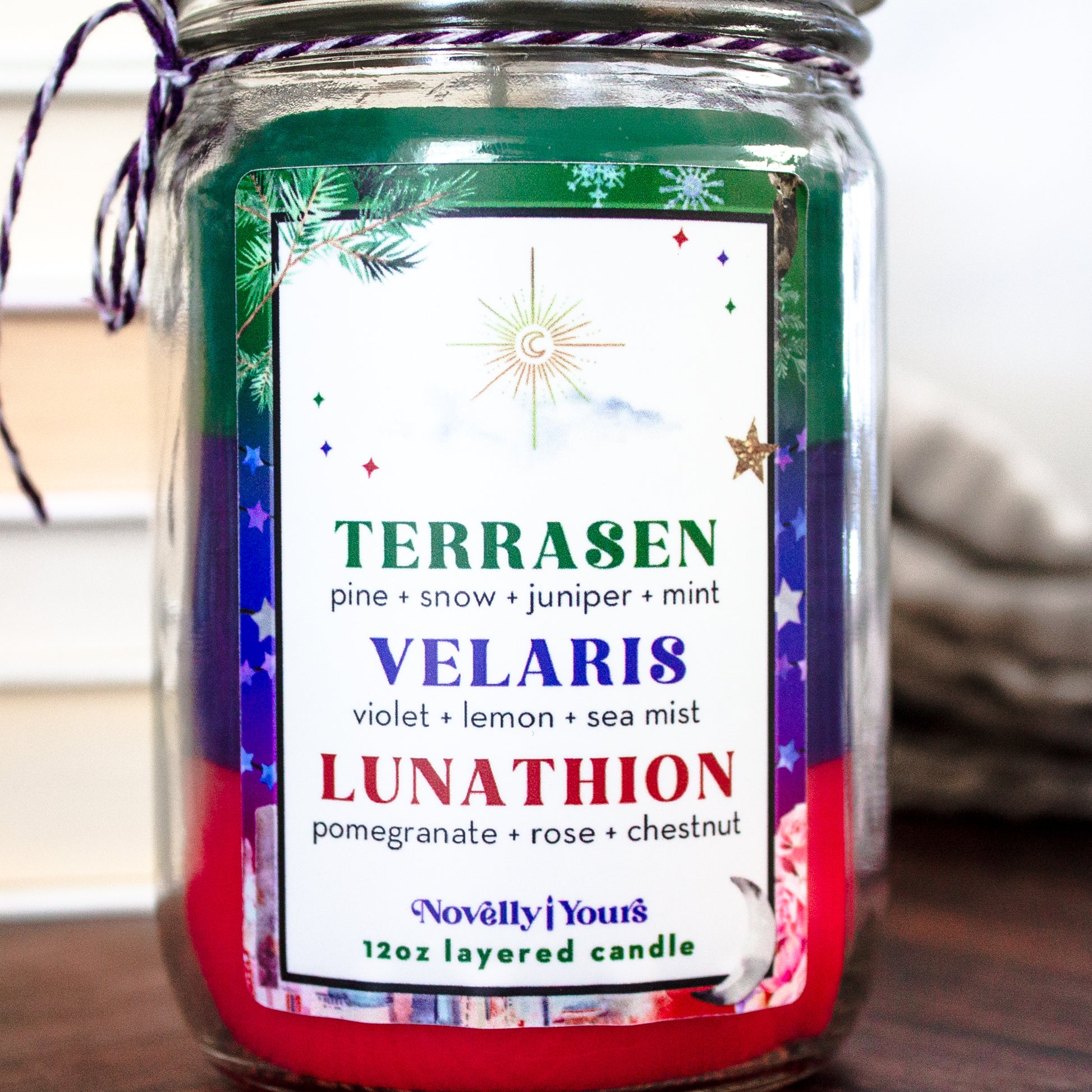 The Worlds of Sarah J. Maas · layered candle